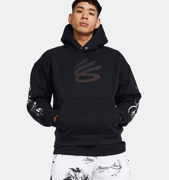 A model wears a black and red Curry Brand hoodie.